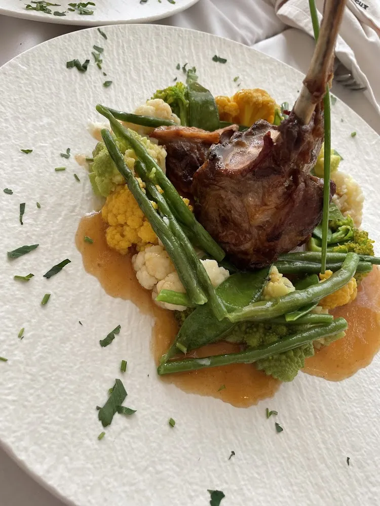 Roasted Rack of Lamb Herbal Juice and Baby Vegetables